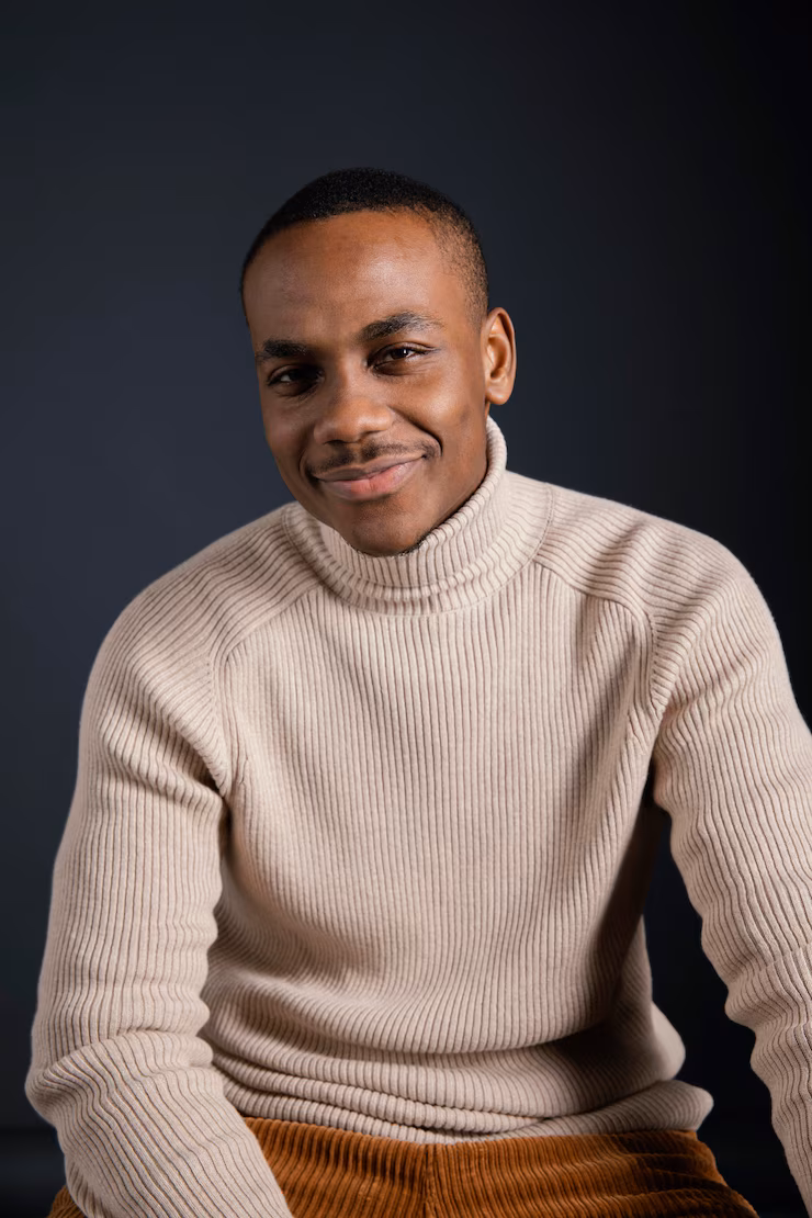 portrait-smiley-man-sitting_23-2148854430